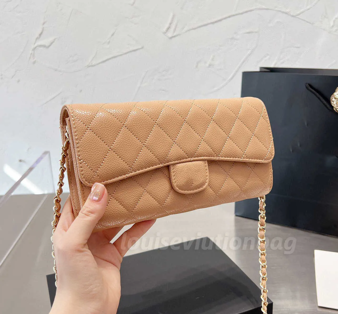 Beige designer shop clutch