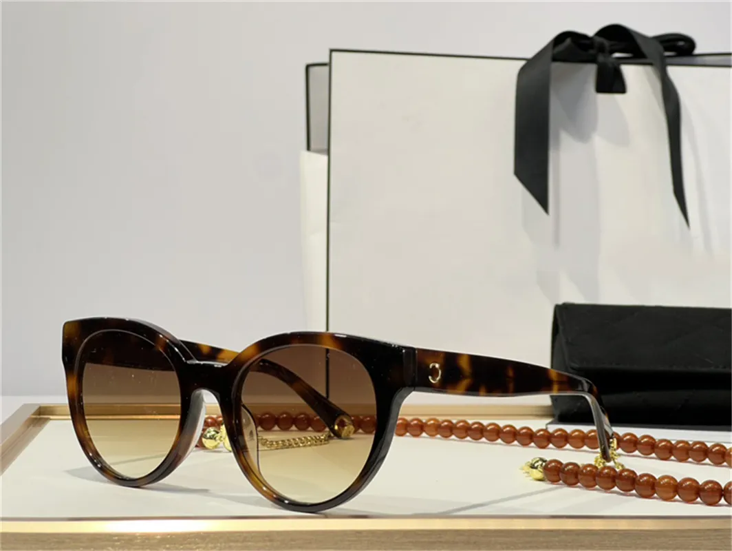 Lunettes de soleil de créateurs de luxe pour femmes créateurs de mode pour femmes lunettes de soleil pour femmes avec chaîne de perles oeil de chat uv400 lentilles de protection lunettes rétro avec étui d'origine
