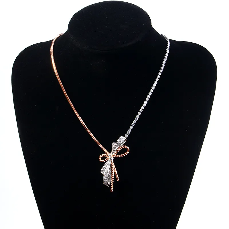 Designer Silver And Gold Cross Bow Necklace With Fine Chain And Diamond
