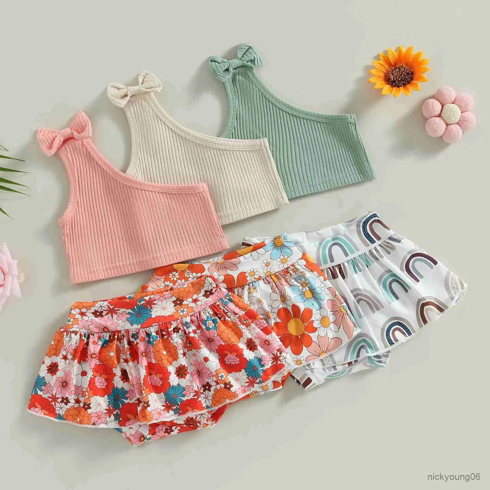Conjuntos de roupas 2pcs meninas meninas roupas de verão ombro tampo sólido e arco -íris/shorts de saia estampada floral
