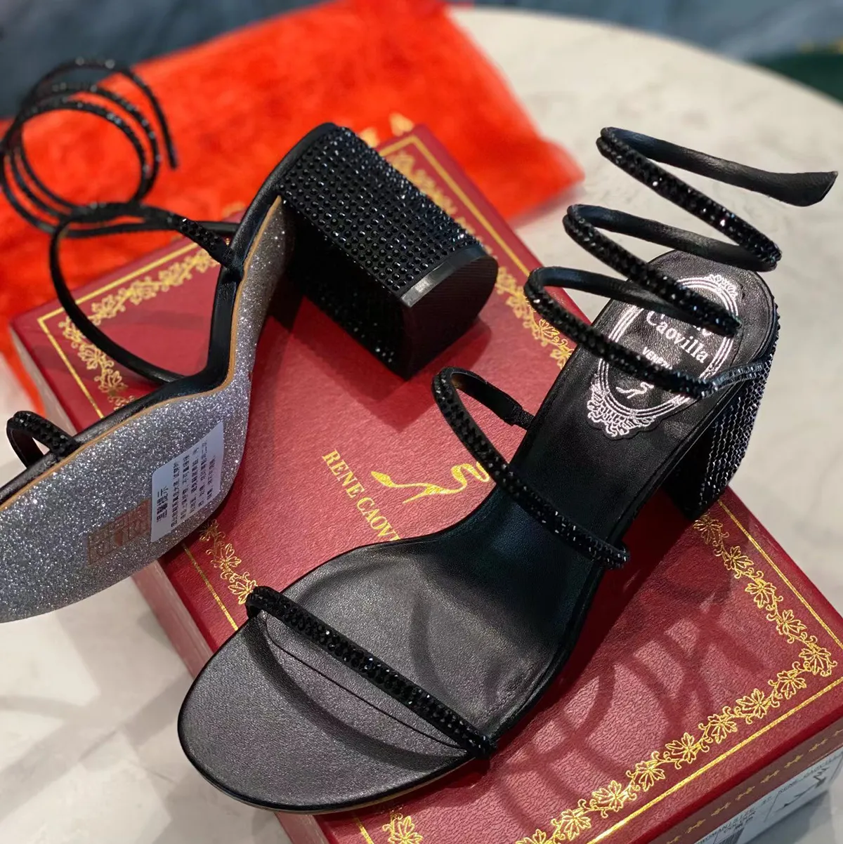 Black heels with discount snake wrapped around ankle
