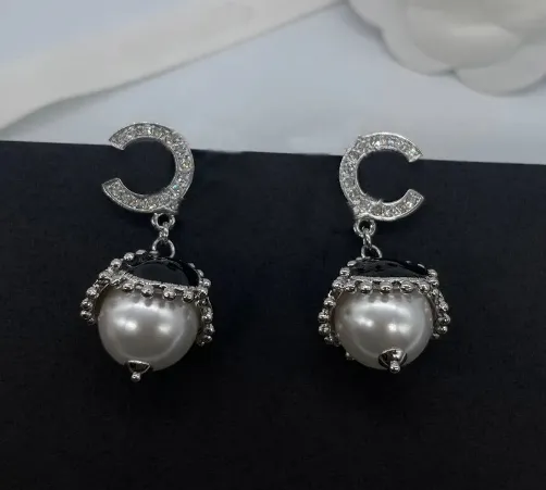 charm drop earring with white nature shell beads in silver plated have stamp box