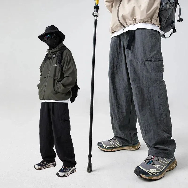 Herenbroeken met zijzakken voor opspattend water zijn ontworpen met losse overalls en broeken, joggingbroeken, joggingbroeken voor heren