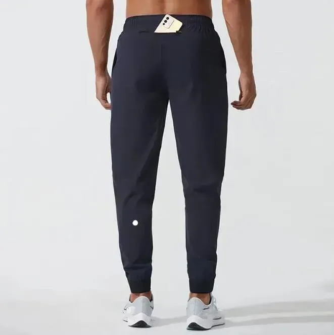 LU Femmes LL Hommes Jogger Pantalons Longs Sport Yoga Tenue Séchage Rapide Cordon De Gym Poches Pantalons De Survêtement Pantalons Casual Taille Élastique Fitness