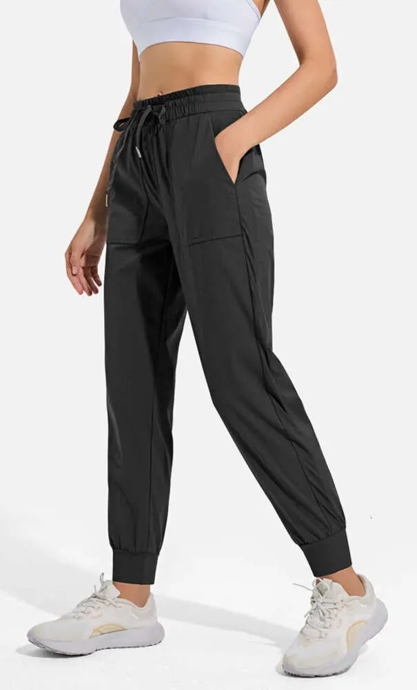 LL Mujeres Correr Yoga Noveno Pantalones Bolsillo Fitness Leggings Suave Cintura Alta Levantamiento De Cadera Elástico Casual Cordón Piernas Pantalones De Chándal 55