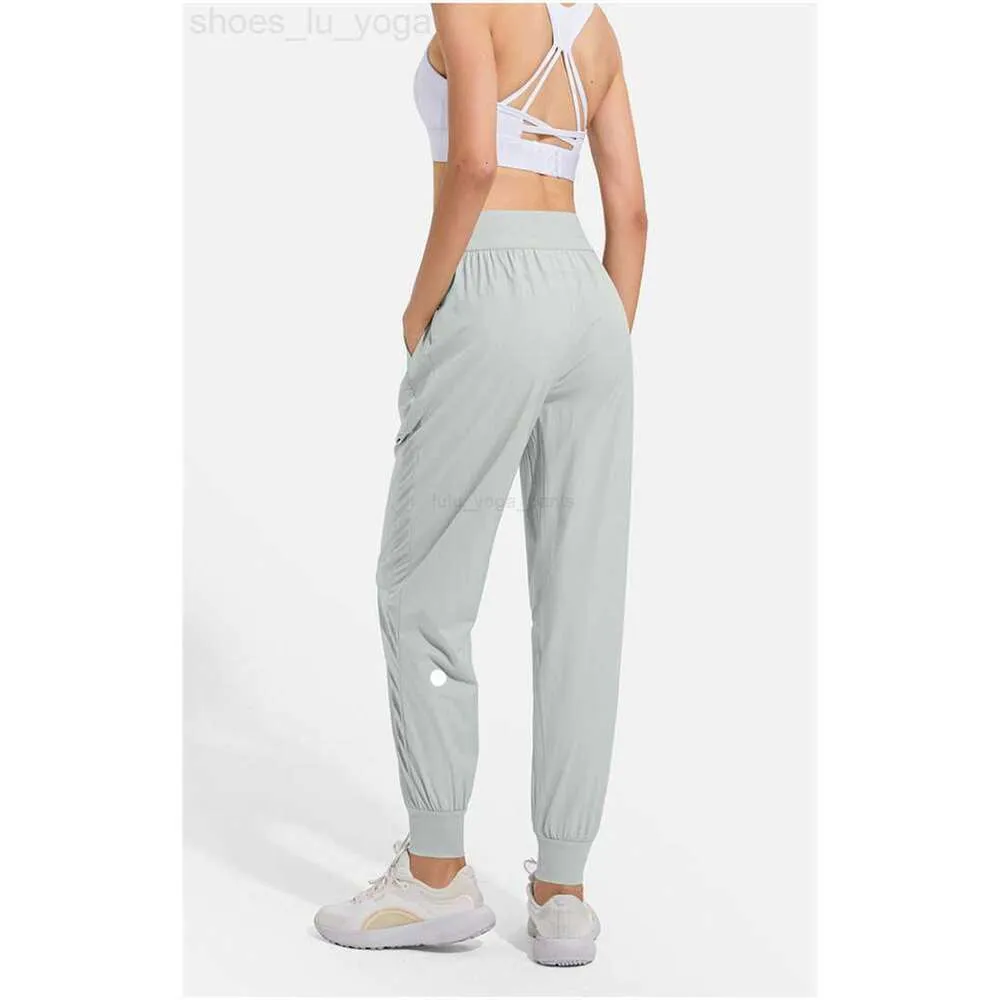 LL Dames Jogging Yoga Negende Broek Zak Fitness-leggings 22 Hoge taille Heuplift Elastisch Toevallig Trekkoord Benen Joggingbroek 333