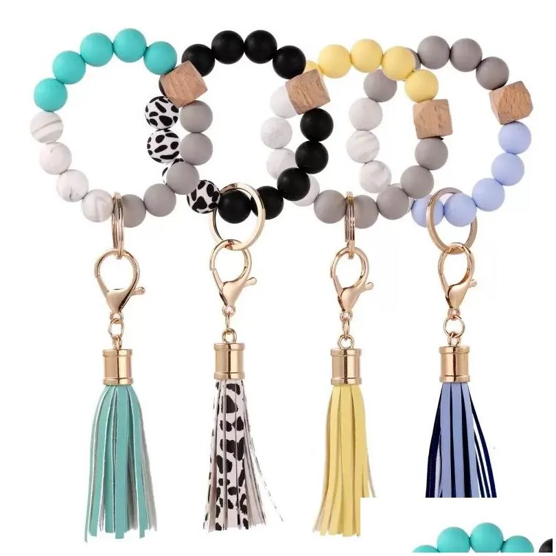 Festa favor sile grânulos de madeira chaveiro camurça tassel pulseira chaveiro anti-perdido pulseira chaveiro para casa madeira frisado artesanato decoração do carro dhliy