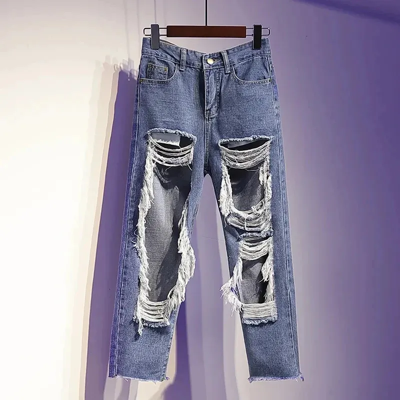 Mäns jeans xpqbb ihålig ut rippade jeans kvinnor personlighet street stil tvättade hål denim byxor kvinna y2k hög midja casual byxor 231206