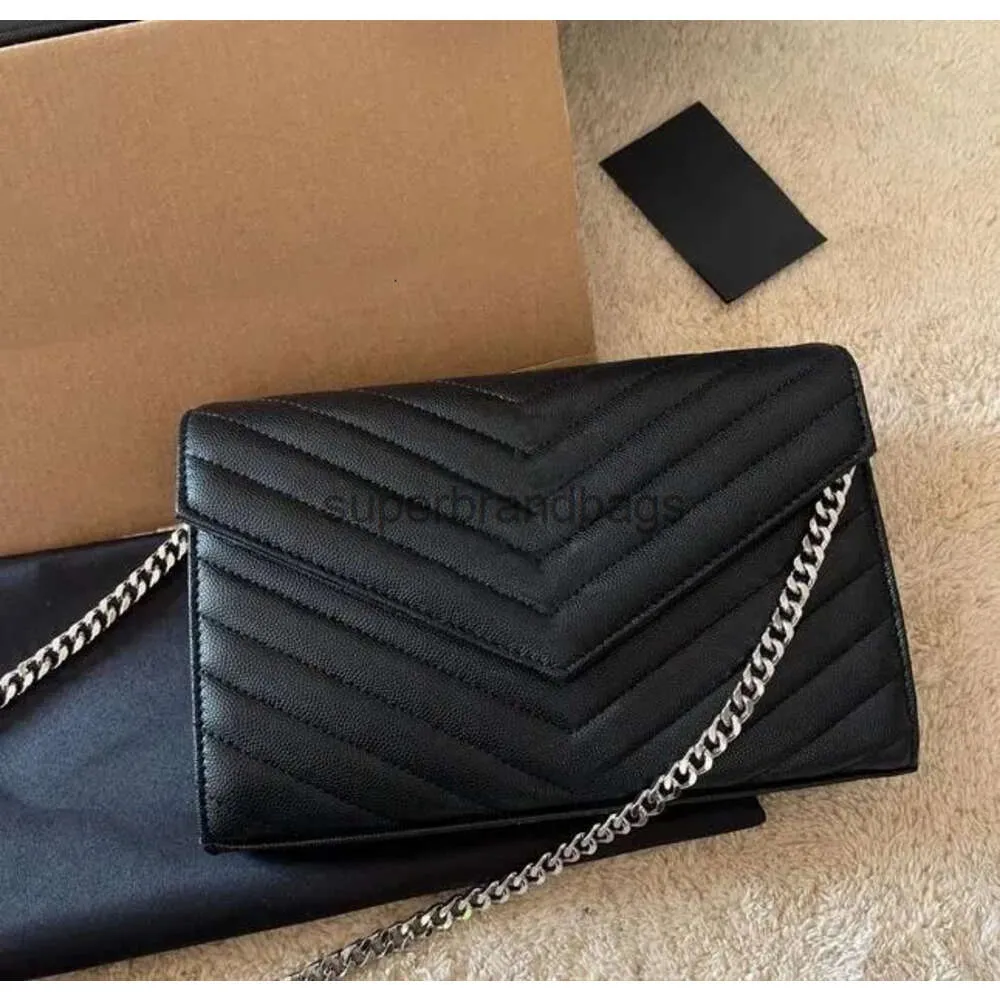 Lyxhöljet Ysles Bag läder kaviar kvinnors woc väska klassisk tote handväska och handväska grossist designer mens plånbok crossbody axelväskor häll