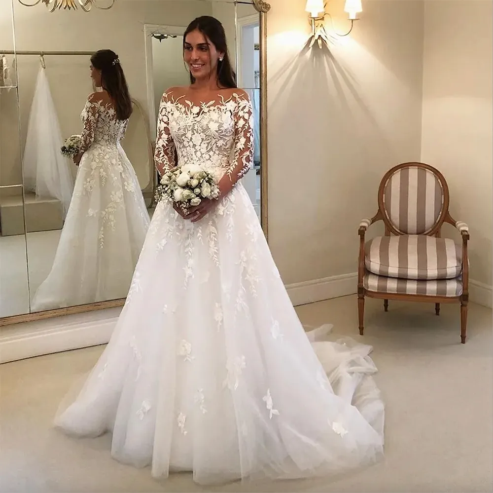 Robes de mariée en dentelle à manches longues impeccables pure bateau cou une ligne couverte bouton dos robes de mariée tulle balayage train robe de mariee