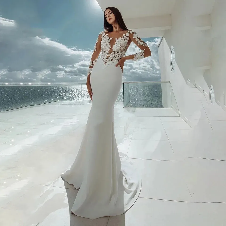 Långa ärmar sjöjungfru bröllopsklänningar vit sexig illusion hals spetsar applikationer eleganta brudklänning klänningar strand vestidos de noiva bröllopsklänningar jarry