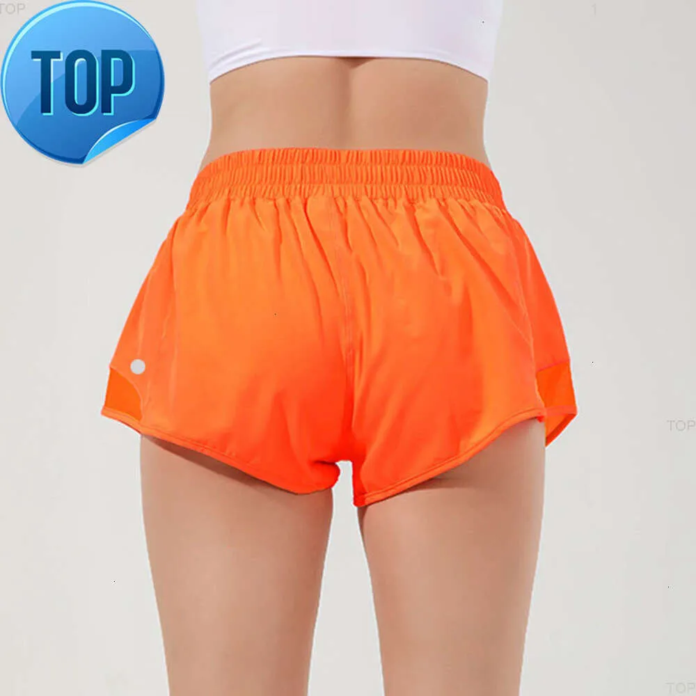 L-091 Short taille basse chaud respirant Yoga à séchage rapide Short de sport doublé intégré Fermeture éclair cachée Poches latérales encastrées Pantalon de survêtement de course avec Cont