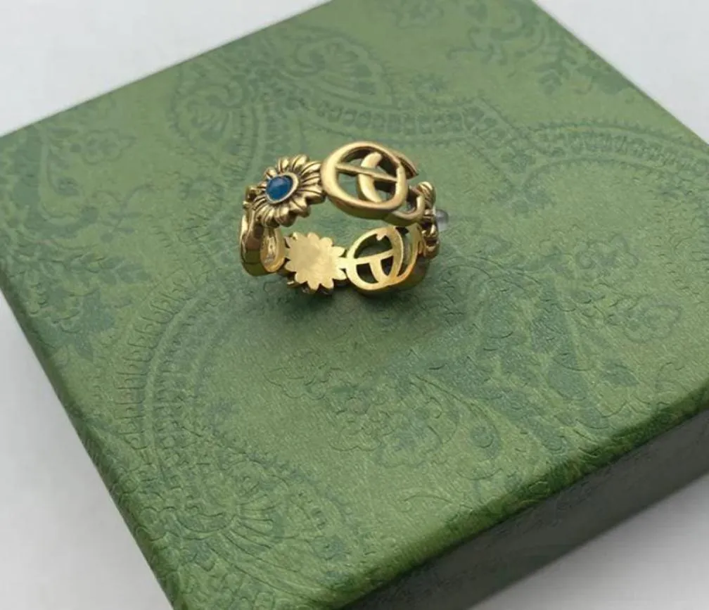 Designer Ring Golden Flower Mönster älskar lyxringar Blue Diamond Fashion Womens smycken Män som skiner G Letter med Box6851975