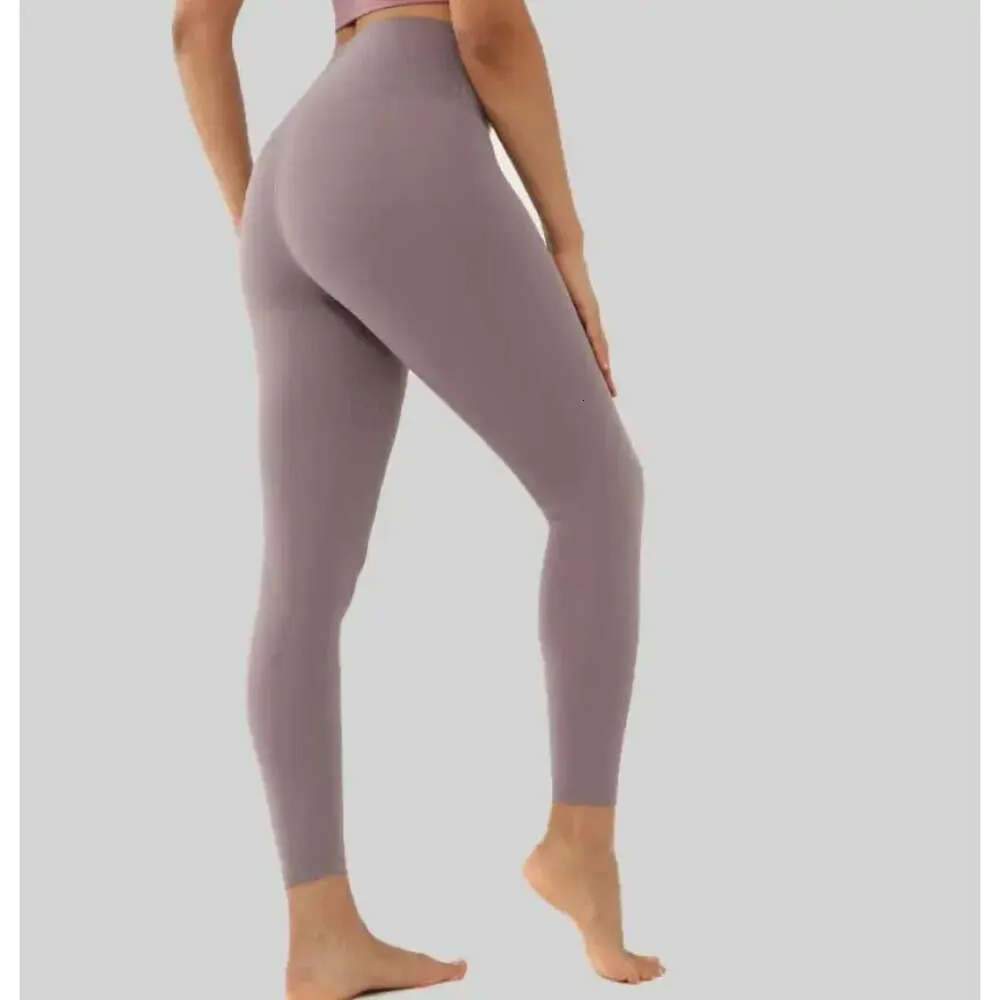 2023 Leggings de yoga pour femmes taille haute couleur unie pleine longueur vêtements de sport femmes pantalons de course mode Fiess Capris collants 688ss