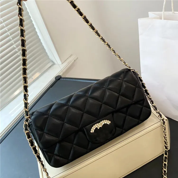 Bolsos de noche con hebilla de diamante para mujer de marca, bolso Baguette de rejilla de gama alta, bolsos cruzados con cadena de cuero