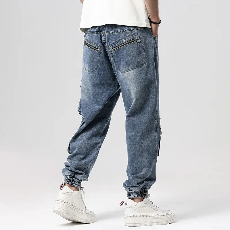 Calças de brim dos homens plus size m8xl moda homens calças de carga multpockets tático jean streetwear hip hop casual masculino denim calças 231212