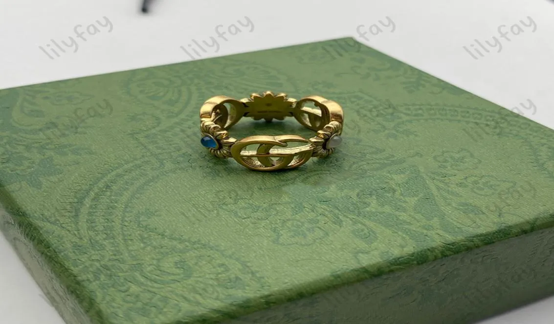 Pierścień designerski Złoty wzór kwiatowy miłość luksusowe pierścionki niebieskie diamentowe moda damska biżuteria lśniona nigdy nie zanikała