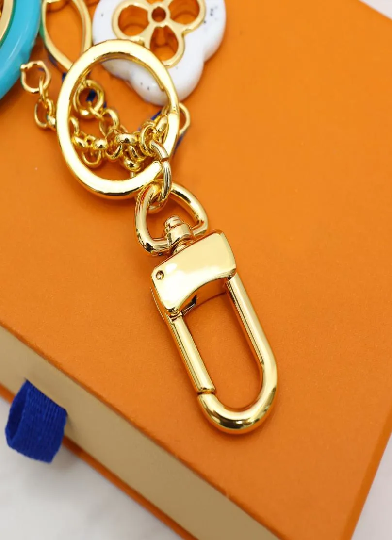 Keychain élégant des clés de luxe de luxe PENDANT GOLD Silver Key Buckle LETTRE Classique Fleur Sac Keychains de haute qualité Or6509791