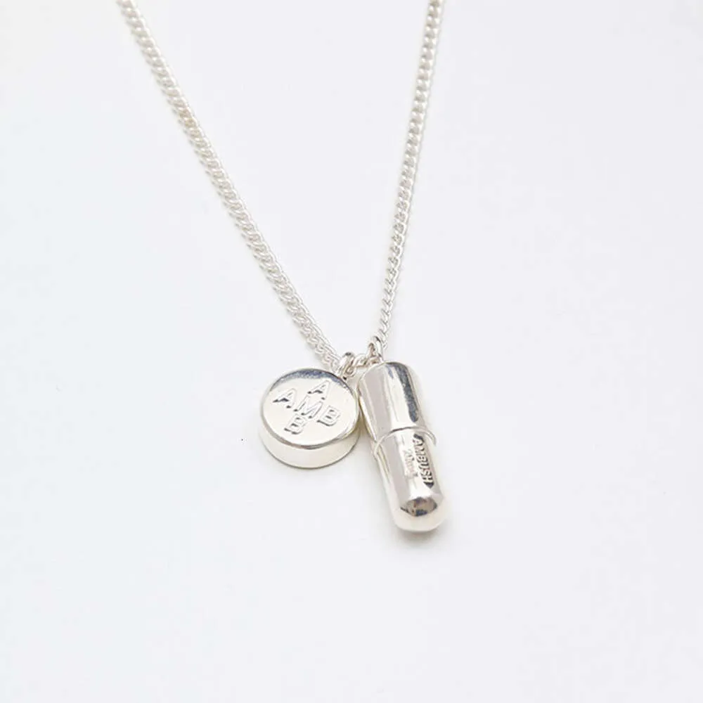 【人気アイテム】AMBUSH PILL CHARM NECKLACE (black) AMBUSH® | #AMBUSH forever-icon, the PILL CHARM, in a matte
