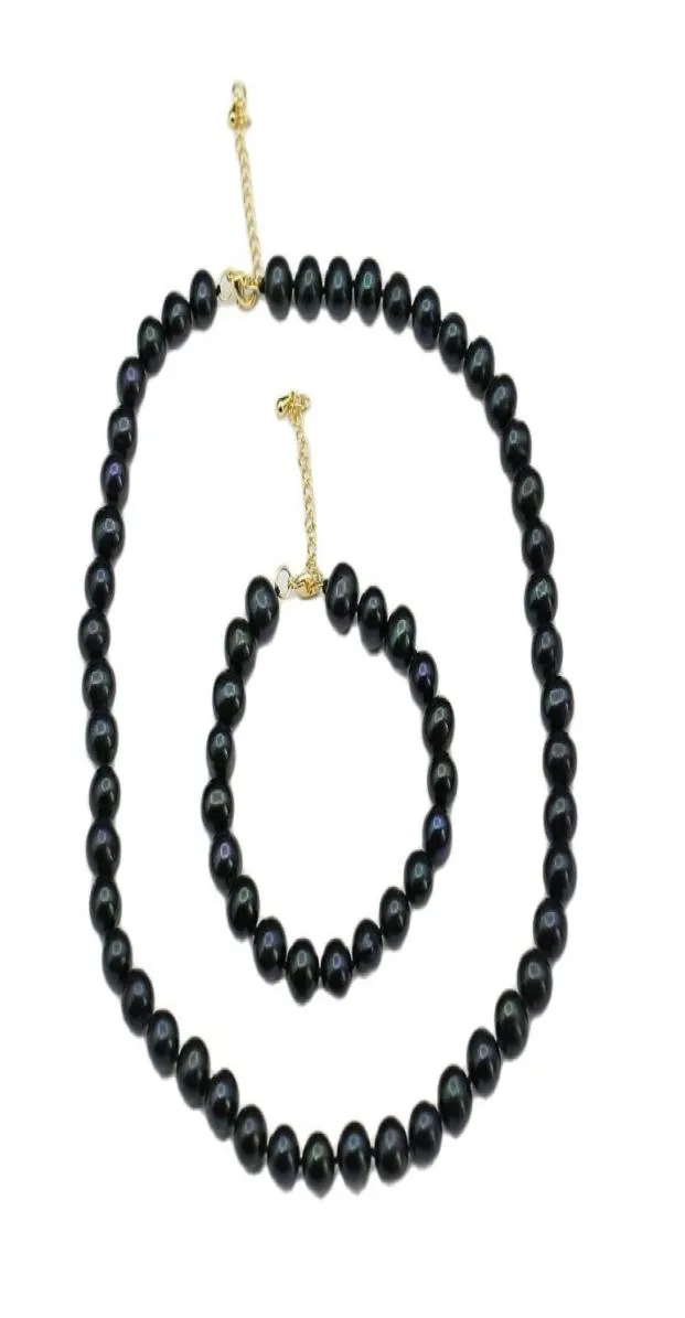 Il braccialetto con collana di perle rotonde nere e blu pavone naturale naturale imposta un regalo semplice per le ragazze della signora8713880