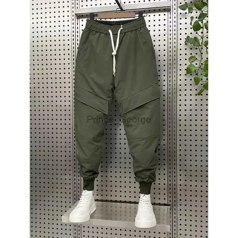 Pantaloni da uomo Abbigliamento uomo Inverno Nuovo caldo piumino di cotone ispessito Tuta da uomo Tasche Pantaloni di cotone Piedi raggruppati Pantaloni Harem Pantalones HombreL2402