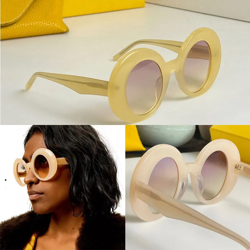 High quality circular fashion runway sunglasses for men and women with curved sheet hip-hop style frame and metal letter symbol decoration on temples 40089 party