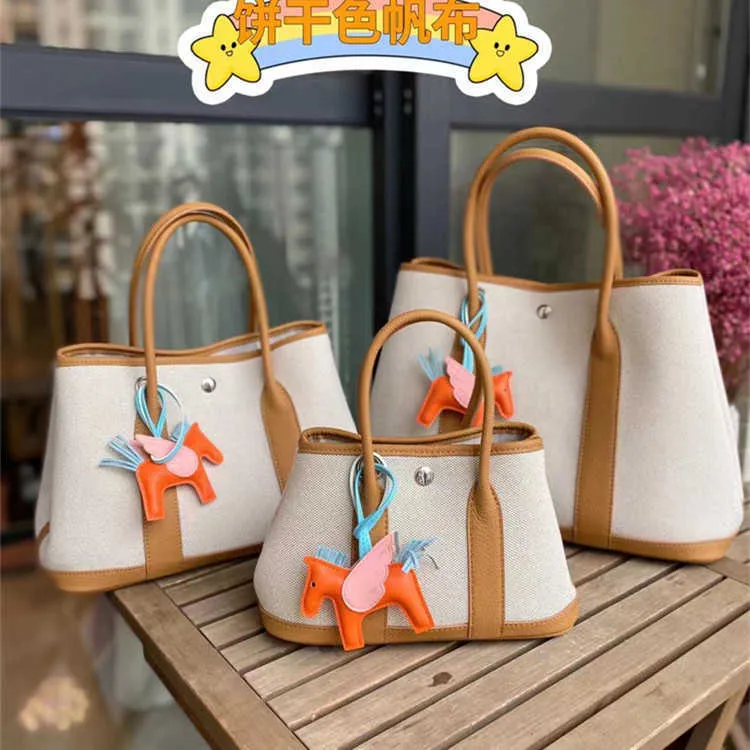 Designer Hremms Party Garden Tote Påsar för kvinnor online -butik Kändis samma stil väska 2023 Ny singel axel crossbody canvas med läder har riktig logotyp