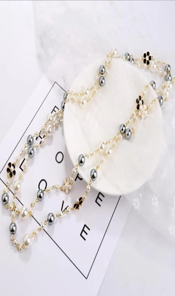 Ladies long pearl necklace pendant wild doublesided drip glaze camellia decorative chain pendant GD11498463958