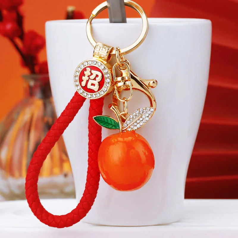 Cai Zhaocaida Orange Dali Car Keychain Women's Bag Pendant Ring with Diamond Embedding Creative Auspicious Gift