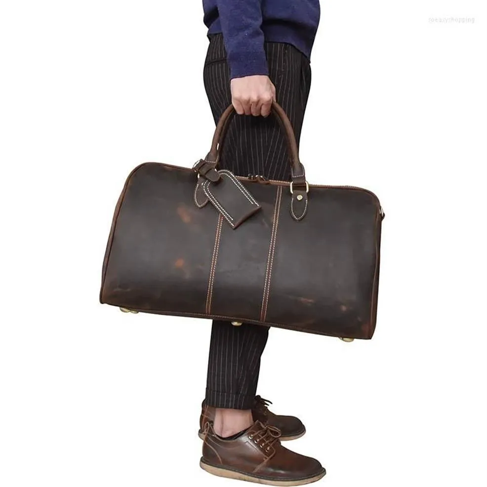 Duffelväskor äkta läder män resväska stor kapacitet kvinnor 20 vintage ko glansigt arbetsbagage