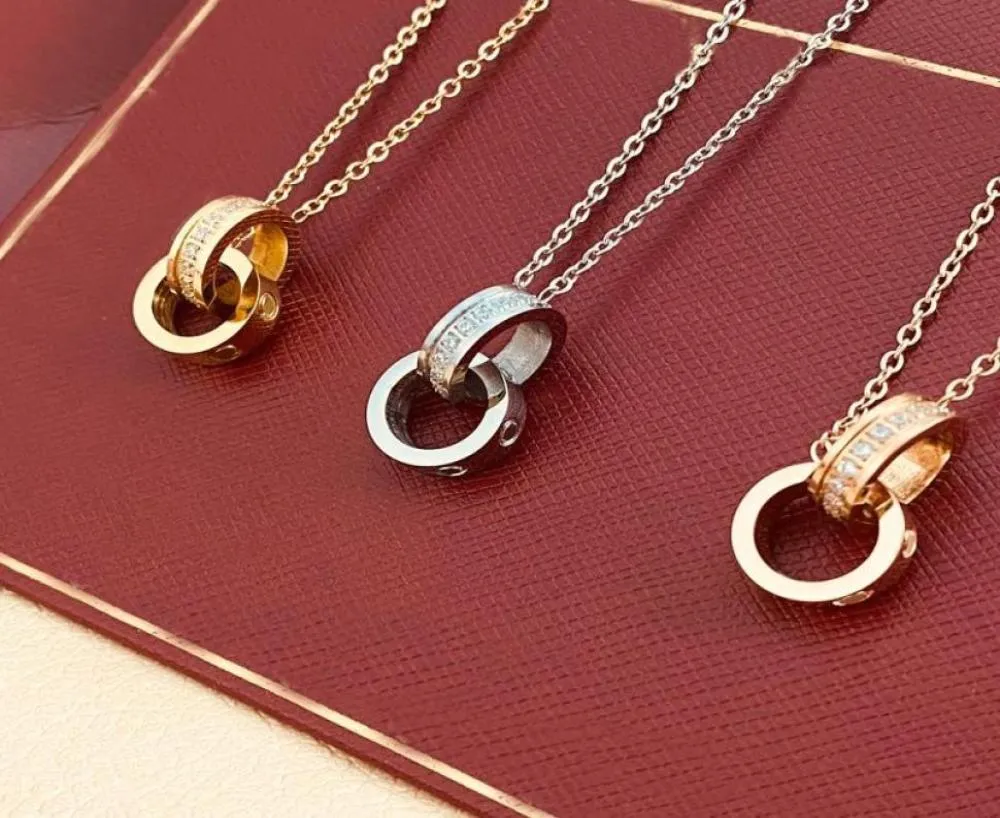 Diseñador Collar de lujo Diseñadores de oro Joyería Plata Anillo doble Regalo de Navidad Cjeweler Hombre Mujer Diamante Amor Colgante2100159