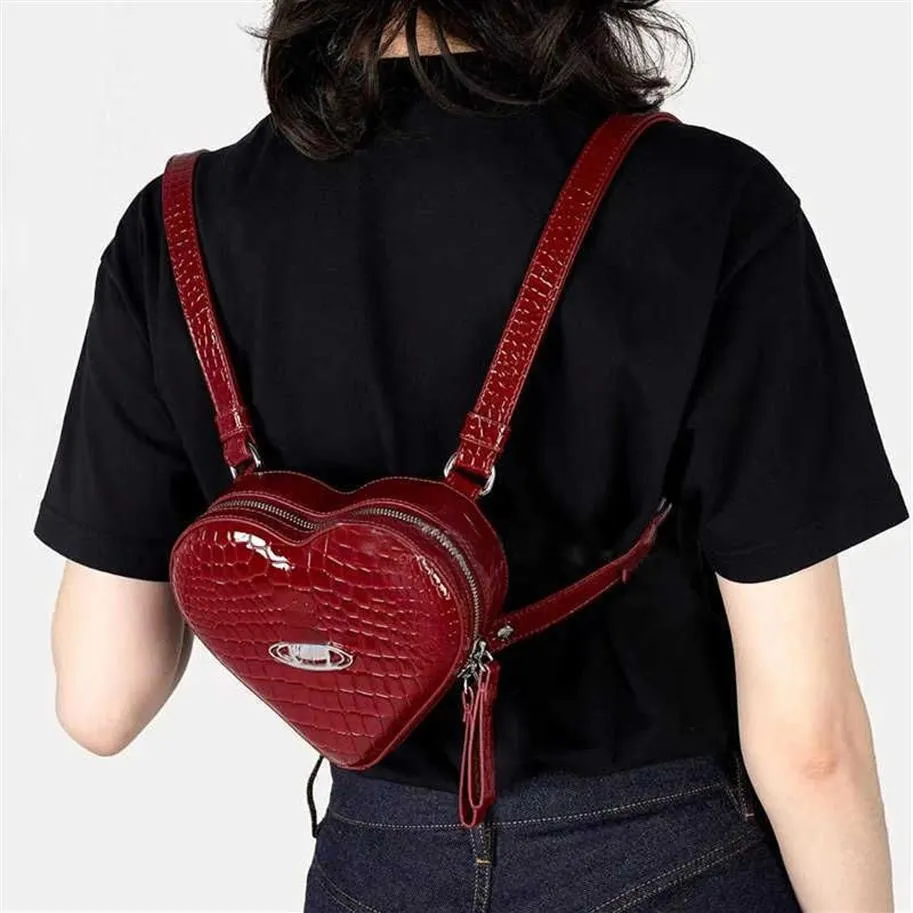 Sacos de noite Vivi Designer Bolsas para Mulheres Padrão de Crocodilo Mochila Japonesa Moda Ombro Crossbody Bag Coração Mini Bookbags F176o