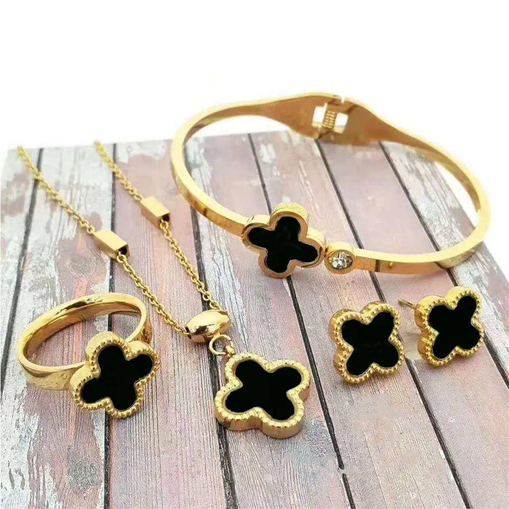 Designer för Woman Gold Plated Four Leaf Clover Earrings Set Fashion Red Agate Halsband Bröllopsfest smycken gåva 4-delad kombinationsdräkt