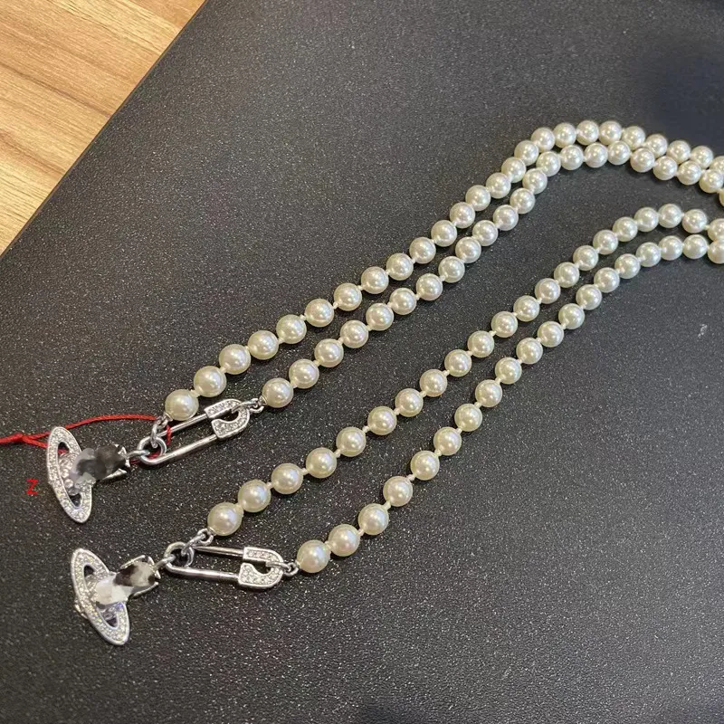 Женские дизайнерские подвесные ожерелья для жемчужного ожерелья Сатурн скрепки Жемчужный подвеска европейская американская винтажная цепь клавиля