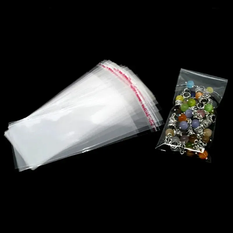 Lådor 1000st Clear Self Adhesive Seal Plastic Påsar smycken Förpackningsdisplay (användbart utrymme 11x5cm) 14x5cm