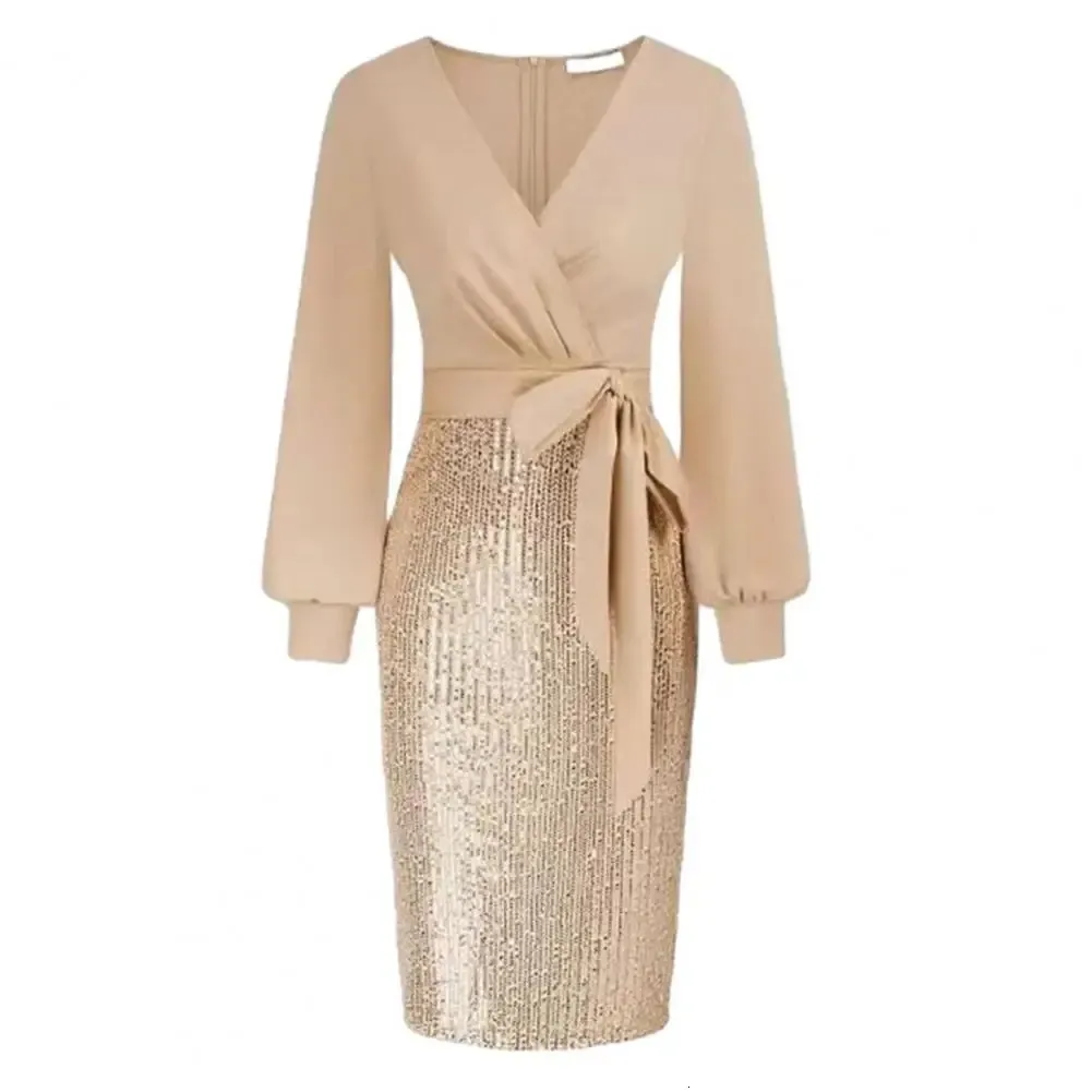 Green sequin dress with cinched waist and V-neckline.