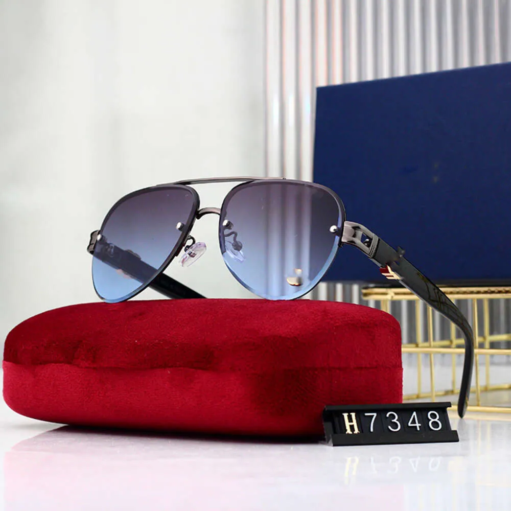 Designer Guucci Cucci Solglasögon Fashionabla och trendiga G-Letter-solglasögon med ramlösa klippkanter solglasögon för kvinnor Färgglad padda spegel för män