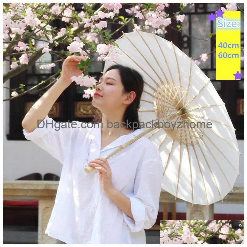 Parapluies Chine Japon Parapluie en papier Parasol traditionnel Cadre en bambou Poignée en bois Parasols de mariage Parapluies artificiels blancs 40 60C Dhtqh