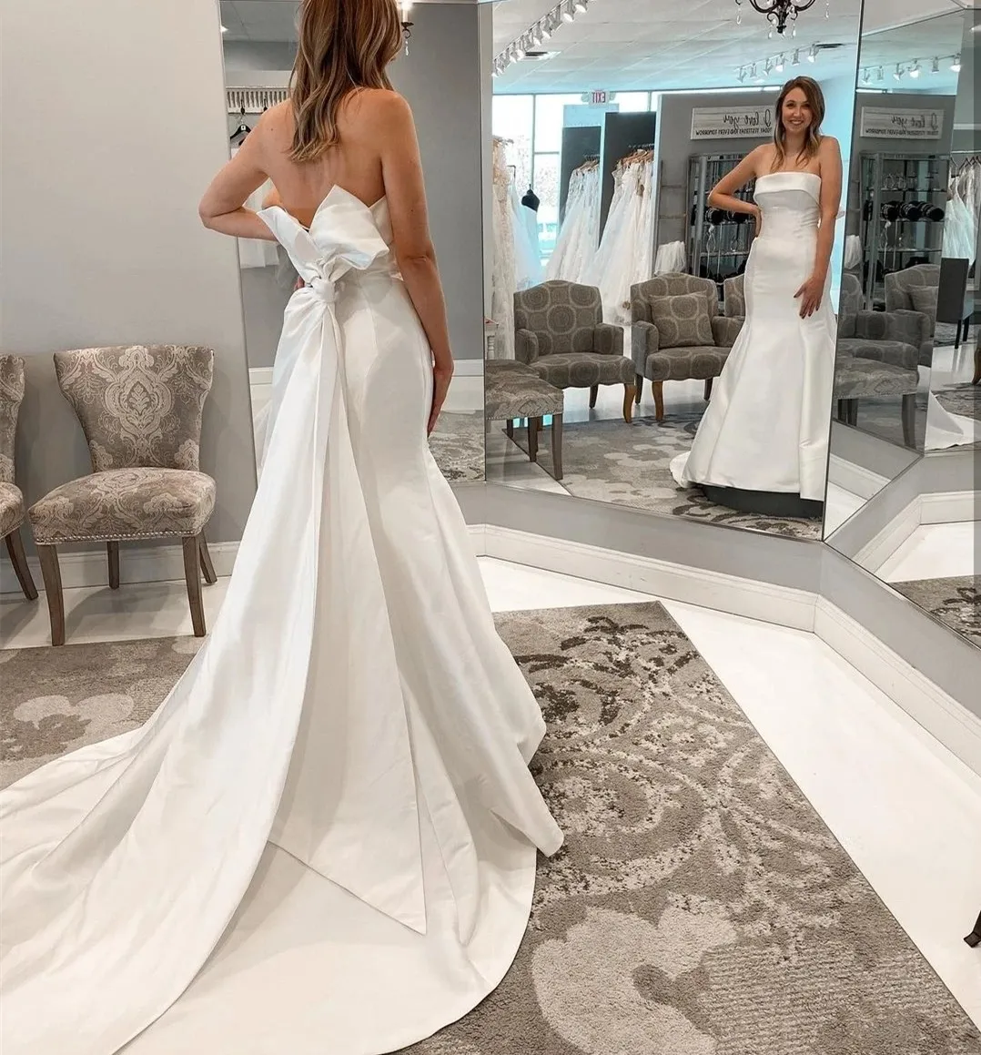 Robe de mariée en satin simple avec nœud 2024 sans bretelles balayage train sirène élégante sur mesure robes de mariée robe de mariée robes de novia