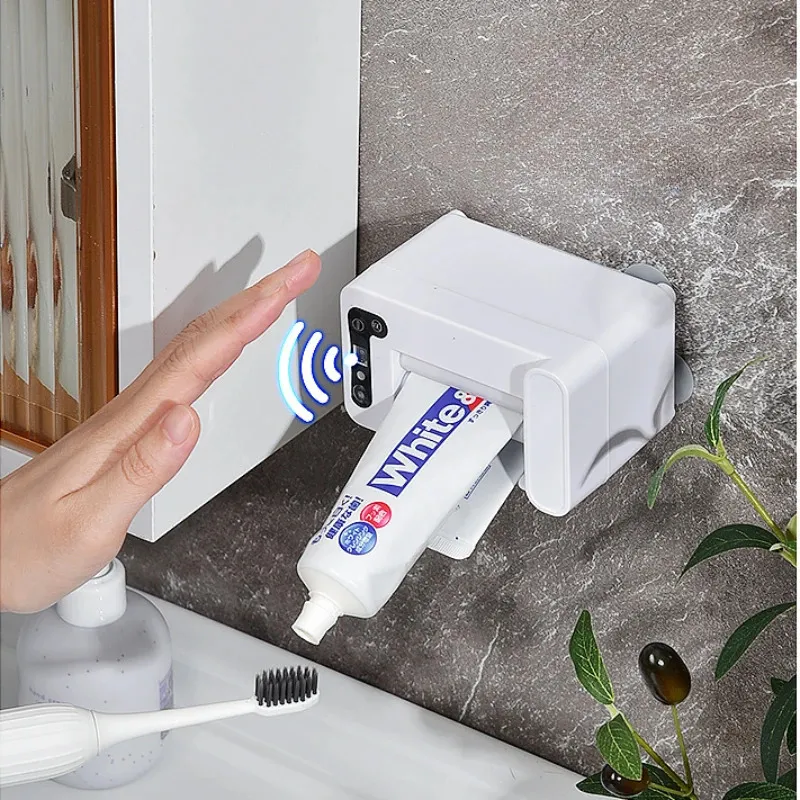 Portaspazzolini Macchina per dentifricio a induzione intelligente Dispenser automatico per spremute elettrico domestico Spremiagrumi pigro a parete 231218