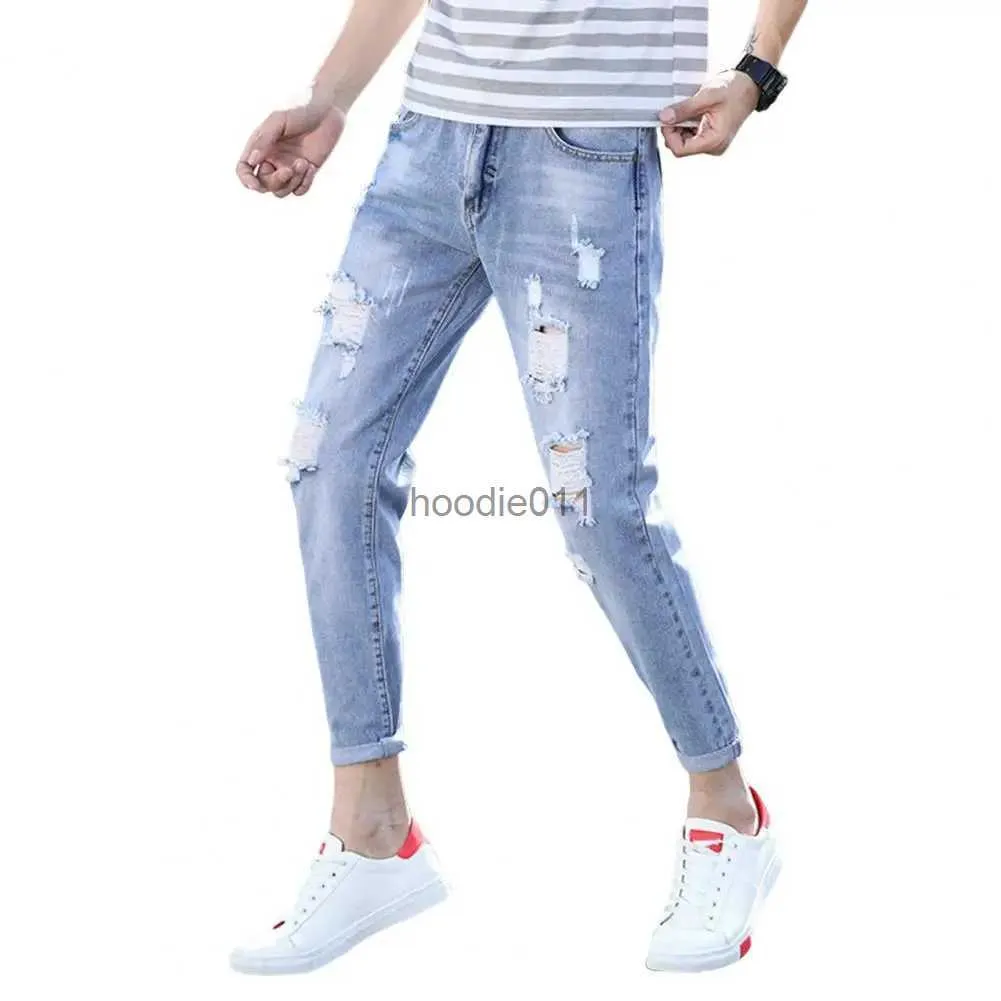 Jeans da uomo stile coreano vita media tasche con cerniera con bottoni uomo slim fit jeans skinny strappati pantaloni slim fit denim streetwear L231220