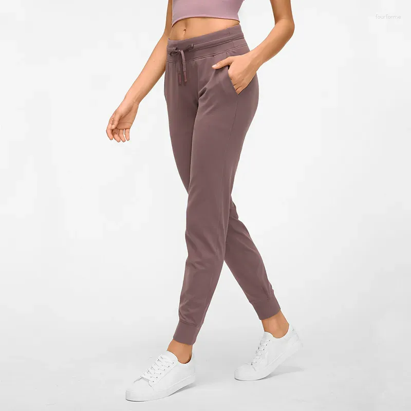 Pantalon féminin 12 couleurs TrawString Fitness Papte de survêtement des femmes avec deux poches latérales Leggings Stretch à 4 voies