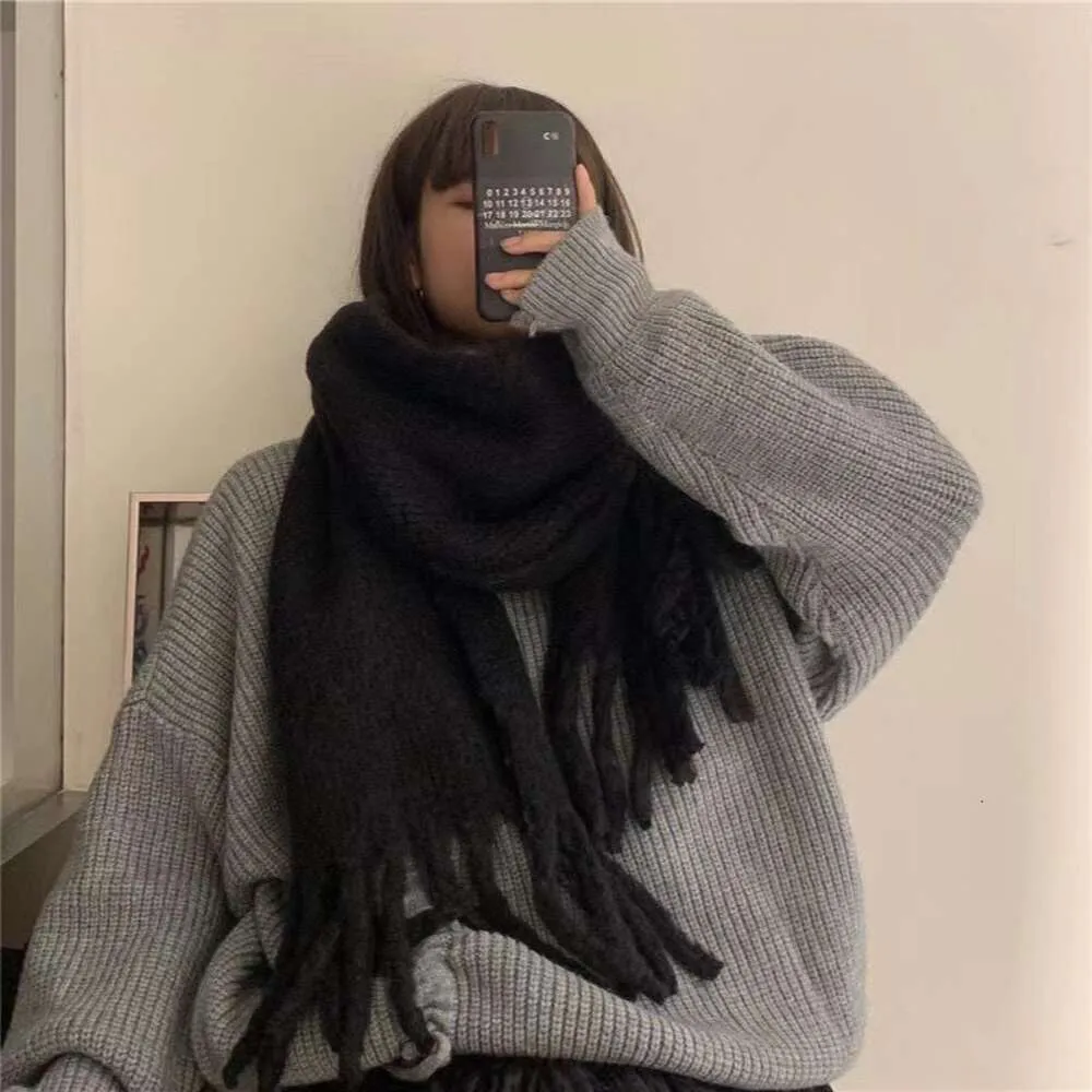 DHgate.com:Korean version solid color big tassel knitted