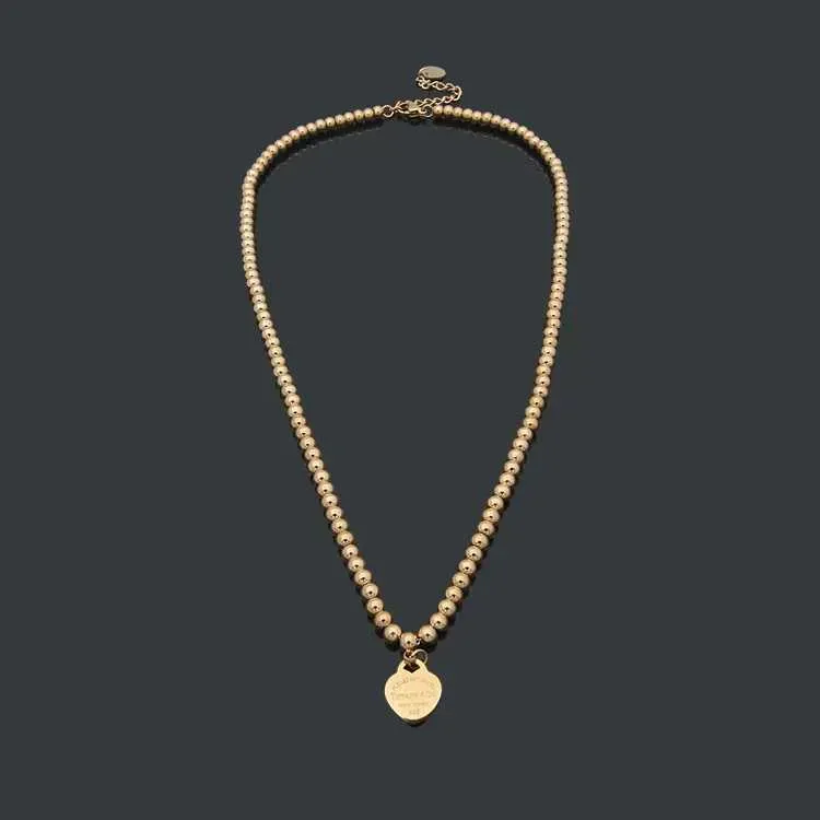 Популярные женские подвесные подарки ожерелья Peach Heart Свадебное мяч Цепное ожерелье Рождественское дизайнерские украшения как золото/серебро/розовая бусинка Tiffanly0a35 0a35