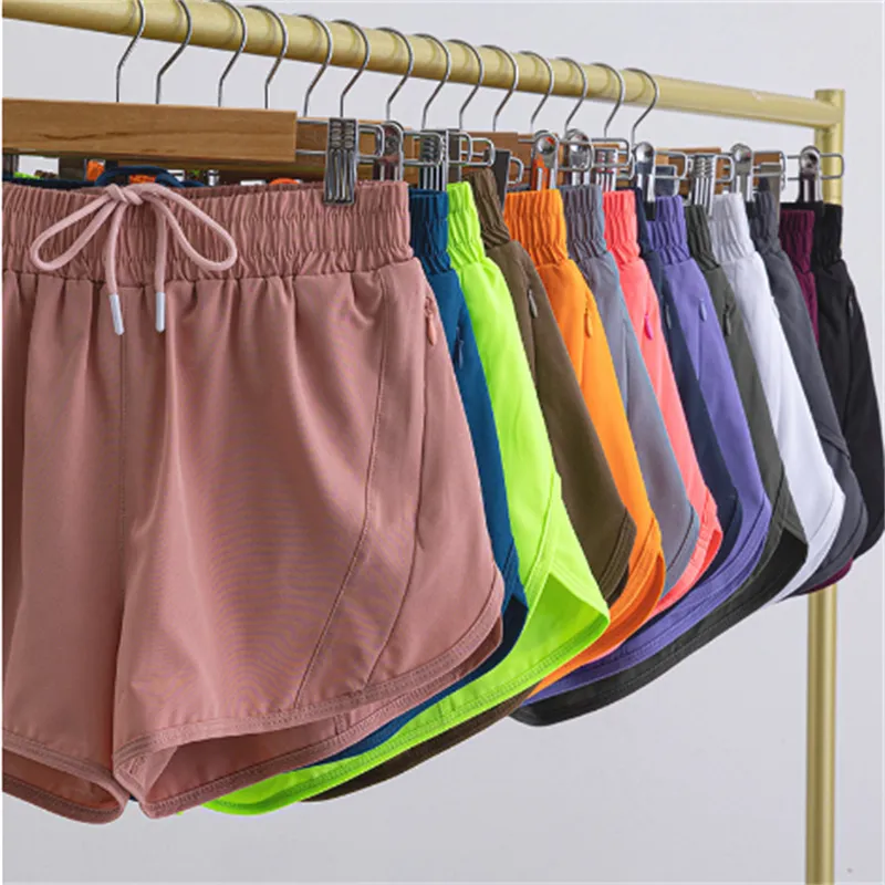 Ll Frauen heiße Hot Shorts Yoga Shorts Outfits mit Übung Fitness tragen Lu kurze Hosen Mädchen, die elastische Hosen Sportbekleidung Taschen laufen lassen