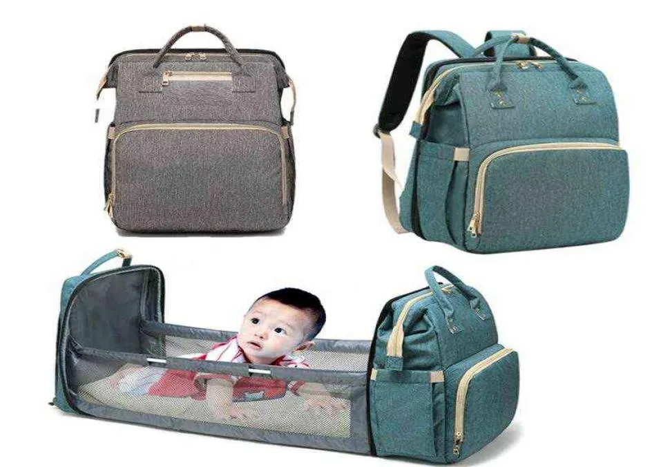 Mommy Diaper Bag Nyfödd baby säng ryggsäck Crib Bassinet Travel bekvämlighet Skicka krokar med Pad H11102348606