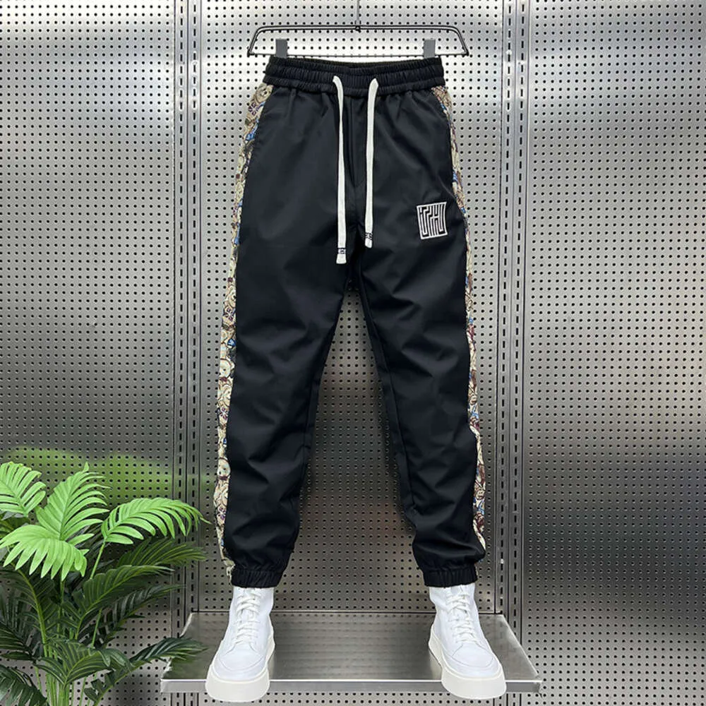 Pantaloni sportivi a righe floreali alla moda Pantaloni da jogging da esterno Abbigliamento da uomo di marca di alta qualità