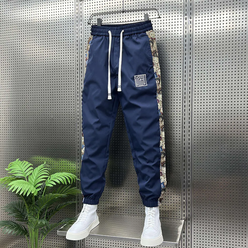 Pantaloni sportivi a righe floreali alla moda Pantaloni da jogging da esterno Abbigliamento da uomo di marca di alta qualità