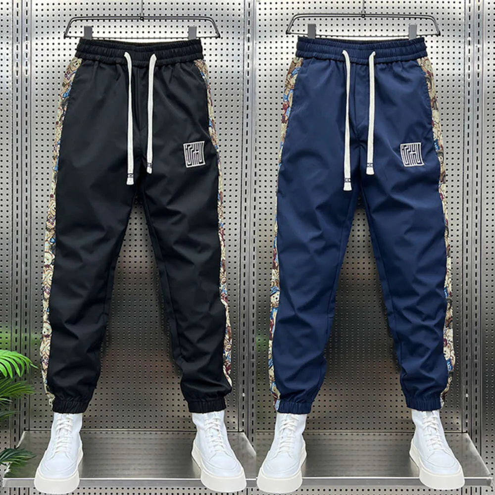 Pantaloni sportivi a righe floreali alla moda Pantaloni da jogging da esterno Abbigliamento da uomo di marca di alta qualità