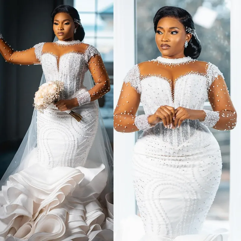 Abiti da sposa Aso Ebi taglie forti Collo trasparente Illusion maniche lunghe Tulle Abiti da sposa in pizzo per Africano Nigeria Donne nere A strati Sirena Perle Abito da sposa D094